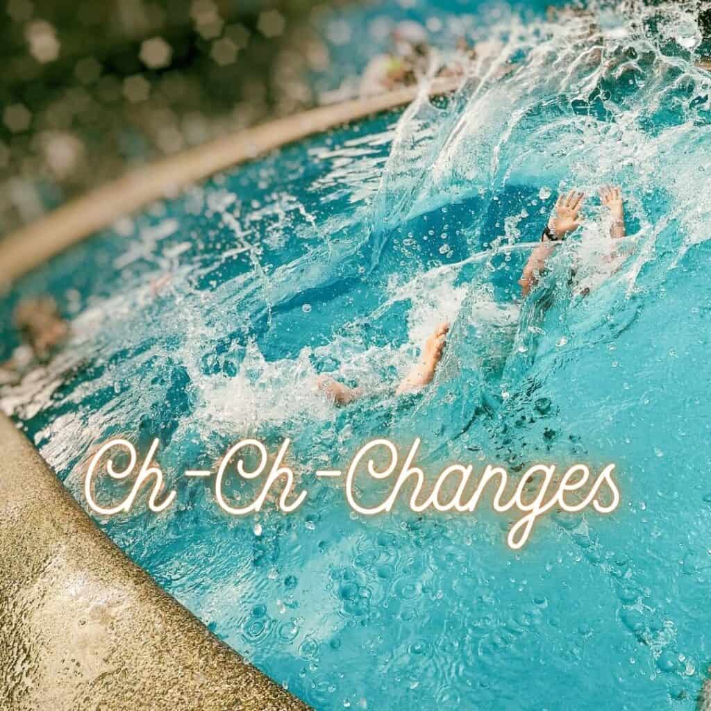 A person splashes in a vibrant blue pool with “Ch-Ch-Changes” in glowing text across the image.
